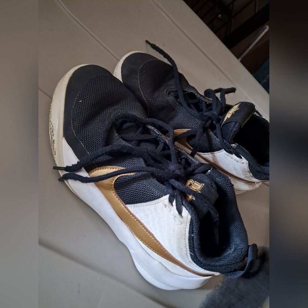 Nike Black and Gold Athletic Shoes- Nike Hustled X SU21